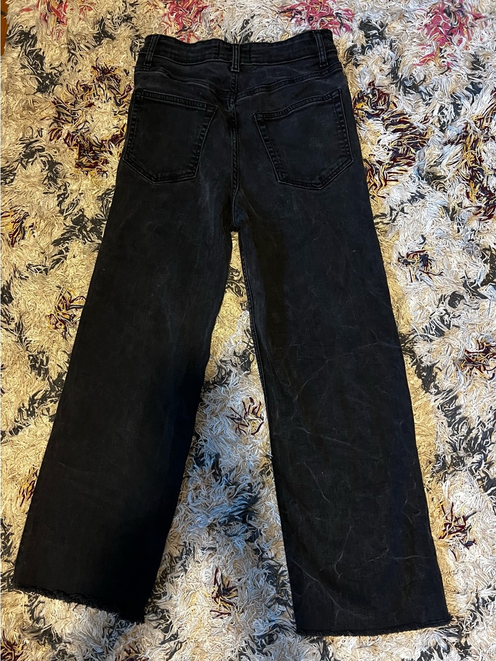 Reformation women’s Black Straight Jeans frayed bottoms. Stretch denim.